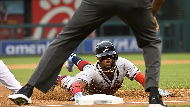 Jul 14, 2022; Washington, District of Columbia, USA; Atlanta Braves right fielder Ronald Acuna Jr. (13) slides into third base during the first inning against the Washington Nationals at Nationals Park. Mandatory Credit: Brad Mills-USA TODAY Sports