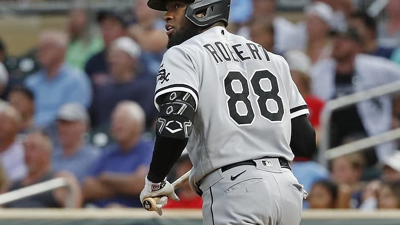 Jul 14, 2022; Minneapolis, Minnesota, USA; Chicago White Sox center fielder Luis Robert (88) watches his grand slam against the Minnesota Twins in the fourth inning at Target Field. Mandatory Credit: Bruce Kluckhohn-USA TODAY Sports