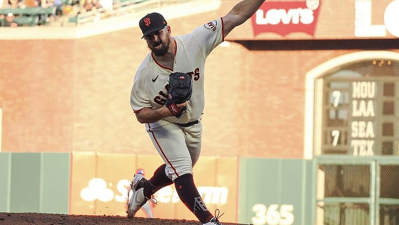 Jul 14, 2022; San Francisco, California, USA; San Francisco Giants starting pitcher Carlos Rodon (16) pitches a third strike-out in a row with the bases loaded against the the Milwaukee Brewers during the second inning at Oracle Park. Mandatory Credit: Kelley L Cox-USA TODAY Sports