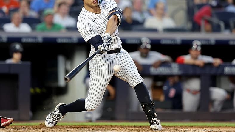 Jul 15, 2022; Bronx, New York, USA; New York Yankees right fielder Giancarlo Stanton (27) hits a three run home run against the Boston Red Sox during the third inning at Yankee Stadium. Mandatory Credit: Brad Penner-USA TODAY Sports