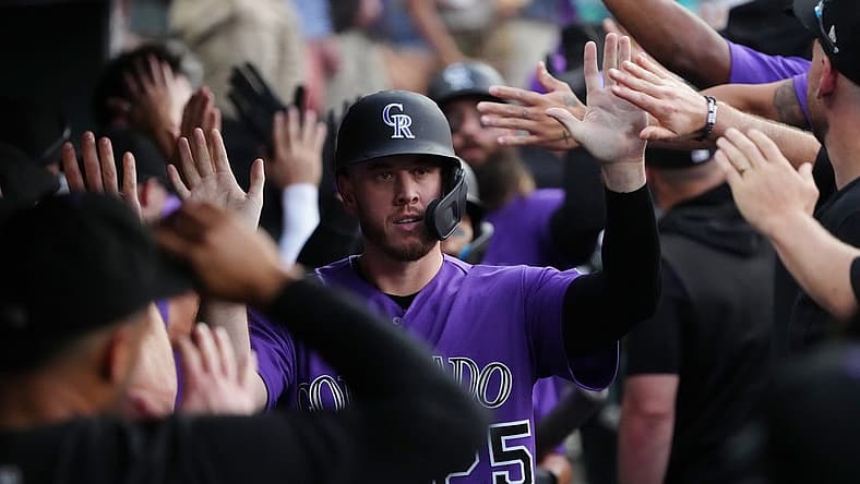 Jul 15, 2022; Denver, Colorado, USA; Colorado Rockies first baseman C.J. Cron (25) celebrates scoring a run in the fifth inning Colorado Rockies at Coors Field. Mandatory Credit: Ron Chenoy-USA TODAY Sports