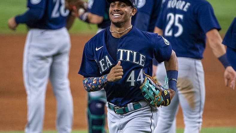 Jul 15, 2022; Arlington, Texas, USA; Seattle Mariners center fielder Julio Rodriguez (44) and the Mariners celebrate the win over the Texas Rangers at Globe Life Field. Mandatory Credit: Jerome Miron-USA TODAY Sports