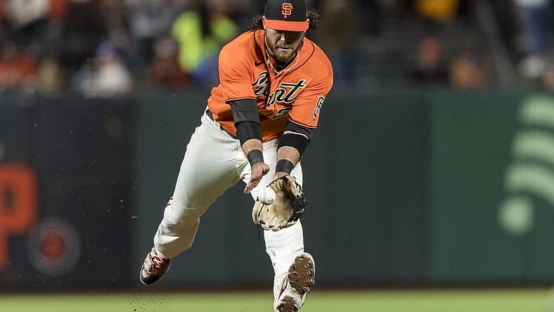 Jul 15, 2022; San Francisco, California, USA; San Francisco Giants shortstop Brandon Crawford (35) fields a ground ball against the Milwaukee Brewers during the sixth inning at Oracle Park. Mandatory Credit: John Hefti-USA TODAY Sports