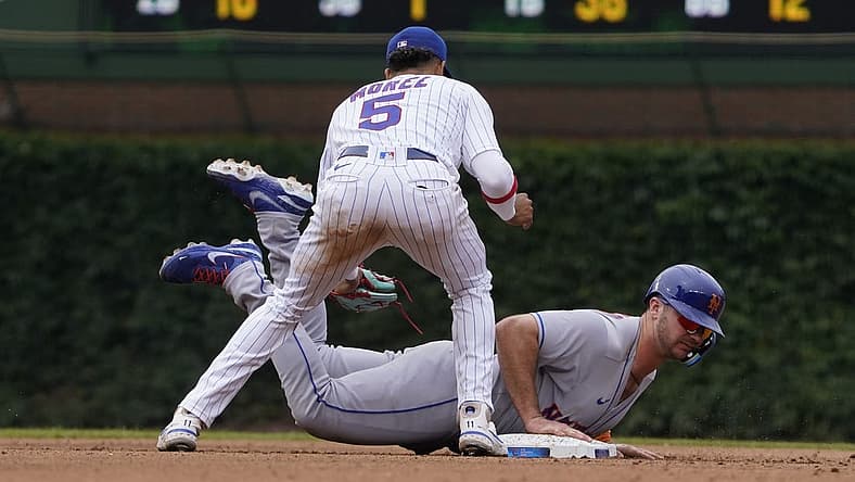 Jul 16, 2022; Chicago, Illinois, USA; New York Mets designated hitter Pete Alonso (20) slides back into second base safely on a pick off attempt as Chicago Cubs second baseman Christopher Morel (5) makes a late tag during the fourth inning in game one of a doubleheader at Wrigley Field. Mandatory Credit: David Banks-USA TODAY Sports