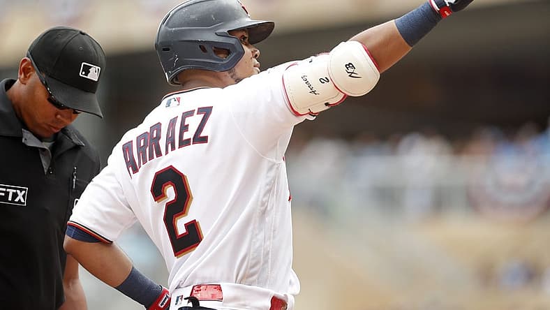 Jul 16, 2022; Minneapolis, Minnesota, USA; Minnesota Twins first baseman Luis Arraez (2) points to the crowd to celebrate his solo home run against the Chicago White Sox in the first inning at Target Field. Mandatory Credit: Bruce Kluckhohn-USA TODAY Sports
