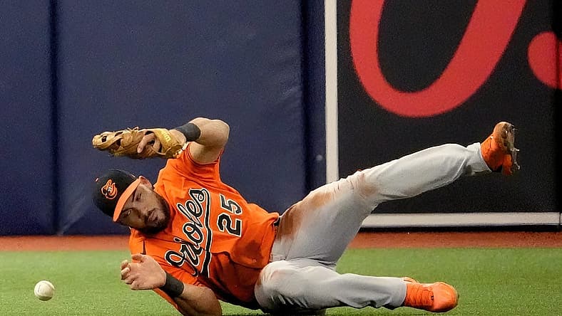 Jul 16, 2022; St. Petersburg, Florida, USA; Baltimore Orioles right fielder Anthony Santander (25) can not make a catch on a ball hit by Tampa Bay Rays right fielder Josh Lowe (15) at Tropicana Field. Mandatory Credit: Dave Nelson-USA TODAY Sports