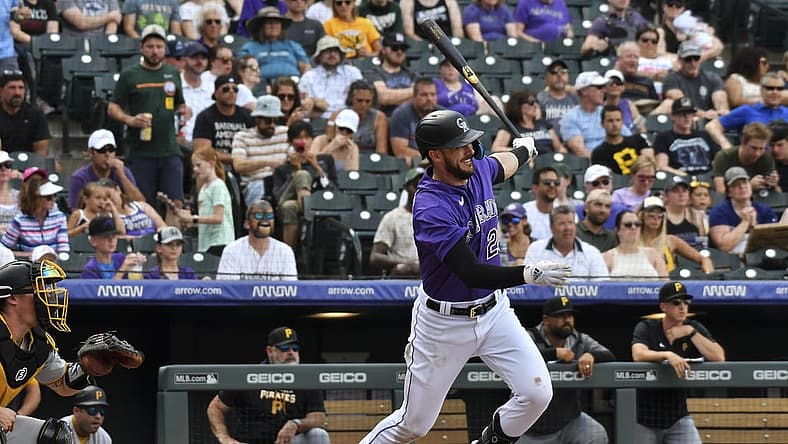 Jul 16, 2022; Denver, Colorado, USA; Colorado Rockies left fielder Kris Bryant (23) gets a base hit in the fifth inning against the Pittsburgh Pirates at Coors Field. Mandatory Credit: John Leyba-USA TODAY Sports