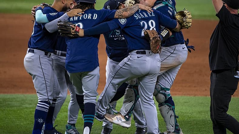 Jul 16, 2022; Arlington, Texas, USA; The Seattle Mariners celebrate the win over the Texas Rangers at Globe Life Field. Mandatory Credit: Jerome Miron-USA TODAY Sports