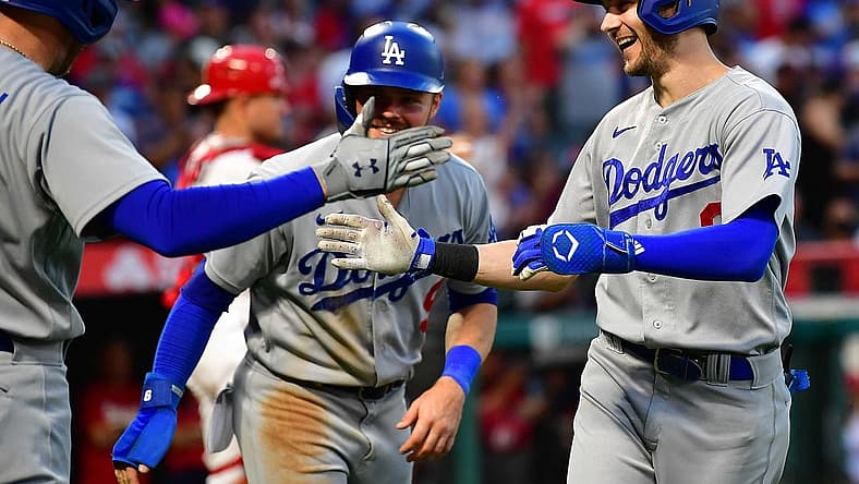 Jul 16, 2022; Anaheim, California, USA; Los Angeles Dodgers shortstop Trea Turner (6) is greeted by first baseman Freddie Freeman (5) and second baseman Gavin Lux (9) after hitting a two run home run against the Los Angeles Angels during the third inning at Angel Stadium. Mandatory Credit: Gary A. Vasquez-USA TODAY Sports