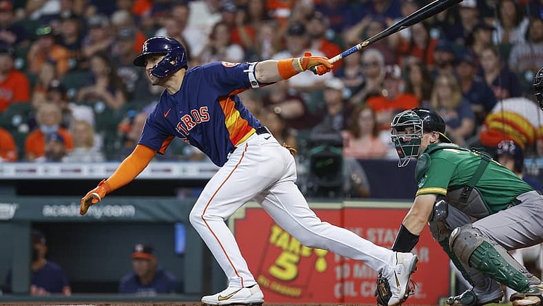 Jul 17, 2022; Houston, Texas, USA; Houston Astros left fielder Aledmys Diaz (16) hits a single during the first inning against the Oakland Athletics at Minute Maid Park. Mandatory Credit: Troy Taormina-USA TODAY Sports