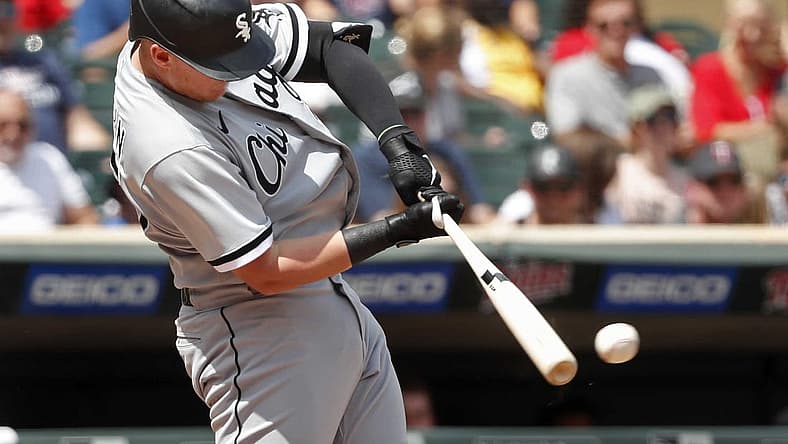 Jul 17, 2022; Minneapolis, Minnesota, USA; Chicago White Sox first baseman Andrew Vaughn (25) hits a two run RBI double against the Minnesota Twins in the fifth inning at Target Field. Mandatory Credit: Bruce Kluckhohn-USA TODAY Sports