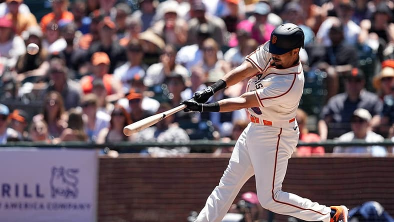 Jul 17, 2022; San Francisco, California, USA; San Francisco Giants first baseman LaMonte Wade Jr. (31) hits a home run against the Milwaukee Brewers during the third inning at Oracle Park. Mandatory Credit: Darren Yamashita-USA TODAY Sports