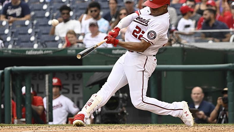 Jul 17, 2022; Washington, District of Columbia, USA; Washington Nationals right fielder Juan Soto (22) hits a solo home run against the Atlanta Braves during the eighth inning at Nationals Park. Mandatory Credit: James A. Pittman-USA TODAY Sports