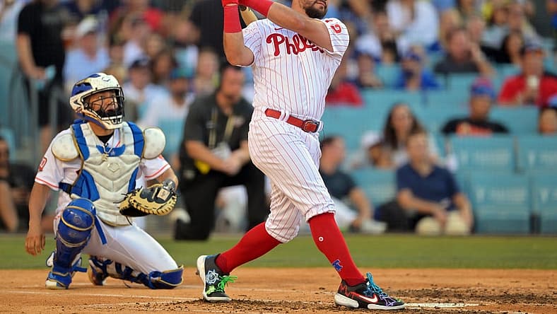 Jul 18, 2022; Los Angeles, CA, USA; Philadelphia Phillies left fielder Kyle Schwarber (12) hits in the first round during the 2022 Home Run Derby at Dodgers Stadium. Mandatory Credit: Jayne Kamin-Oncea-USA TODAY Sports