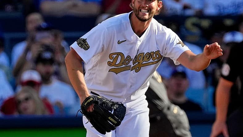 Jul 19, 2022; Los Angeles, California, USA; National League starting pitcher Clayton Kershaw (22) of the Los Angeles Dodgers reacts after giving up a single to American League pitcher/designated hitter Shohei Ohtani (17) of the Los Angeles Angels during the first inning in the 2022 MLB All Star Game at Dodger Stadium. Mandatory Credit: Robert Hanashiro-USA TODAY Sports