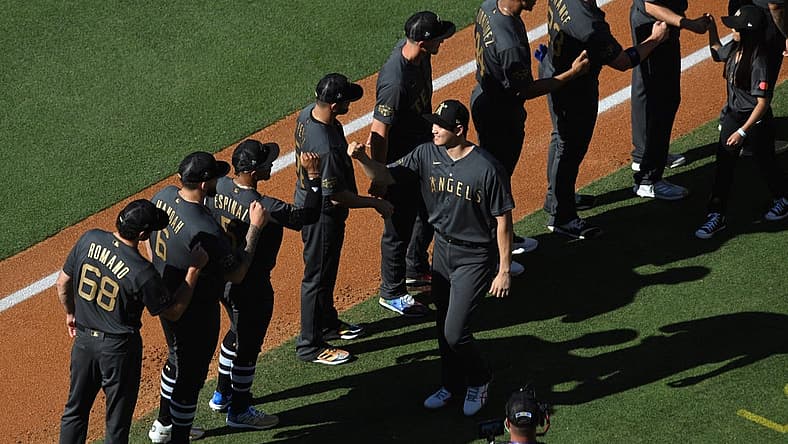 Jul 19, 2022; Los Angeles, California, USA; American League pitcher/designated hitter Shohei Ohtani (17) of the Los Angeles Angels greets teammates during player introductions before the game against the National League at Dodger Stadium. Mandatory Credit: Orlando Ramirez-USA TODAY Sports