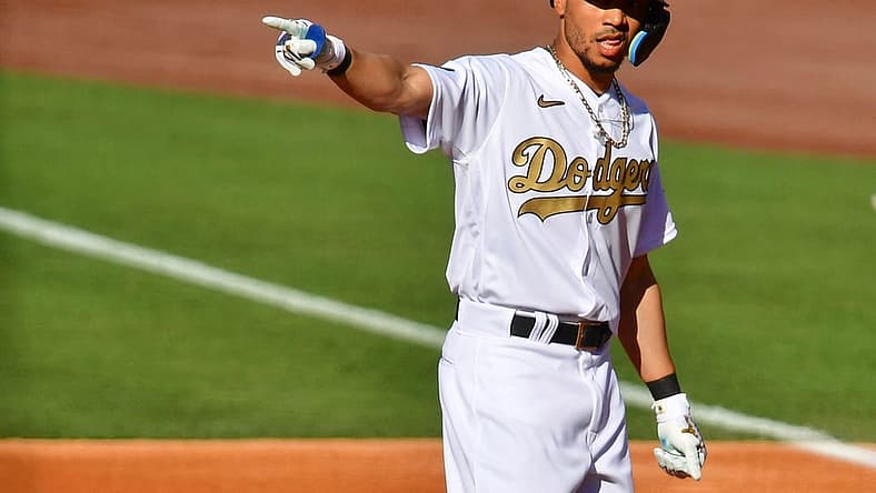 Jul 19, 2022; Los Angeles, California, USA; National League outfielder Mookie Betts (50) of the Los Angeles Dodgers reacts after hitting an RBI double against the American League during the first inning of the 2022 MLB All Star Game at Dodger Stadium. Mandatory Credit: Gary Vasquez-USA TODAY Sports