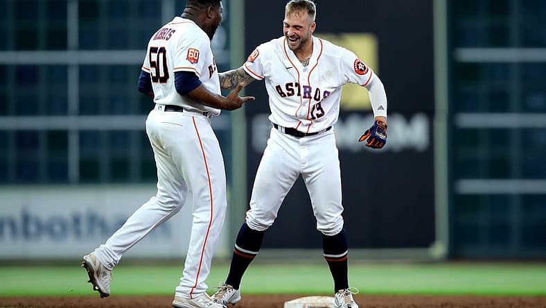 Jul 21, 2022; Houston, Texas, USA; Houston Astros pinch hitter J.J. Matijevic (13, right) is congratulated by Houston Astros relief pitcher Hector Neris (50, left) after hitting a walkoff RBI single against the New York Yankees during the ninth inning at Minute Maid Park. Mandatory Credit: Erik Williams-USA TODAY Sports