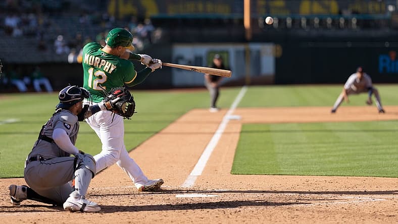 Jul 21, 2022; Oakland, California, USA; Oakland Athletics catcher Sean Murphy (12) hits a three run home run during the sixth inning against the Detroit Tigers at RingCentral Coliseum. Mandatory Credit: Stan Szeto-USA TODAY Sports