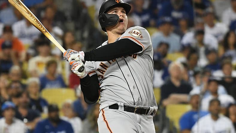 Jul 21, 2022; Los Angeles, California, USA; San Francisco Giants left fielder Joc Pederson (23) hits a double in the eight inning against the Los Angeles Dodgers at Dodger Stadium. Mandatory Credit: Richard Mackson-USA TODAY Sports