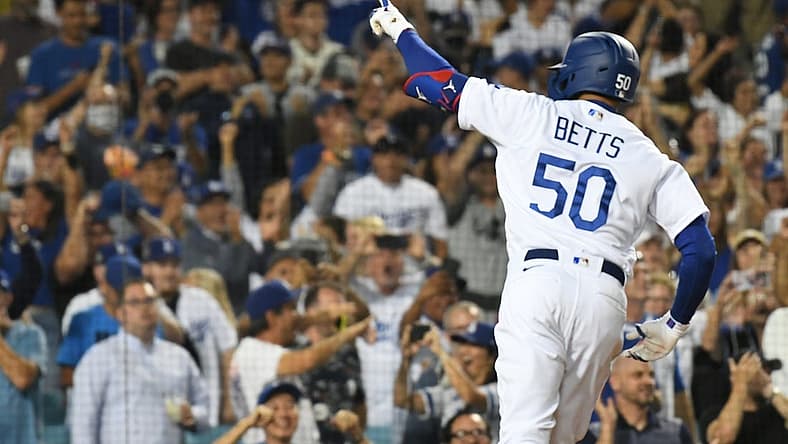 Jul 21, 2022; Los Angeles, California, USA; Los Angeles Dodgers right fielder Mookie Betts (50) celebrates hitting a three run home run in the eighth inning against the San Francisco Giants at Dodger Stadium. Mandatory Credit: Richard Mackson-USA TODAY Sports