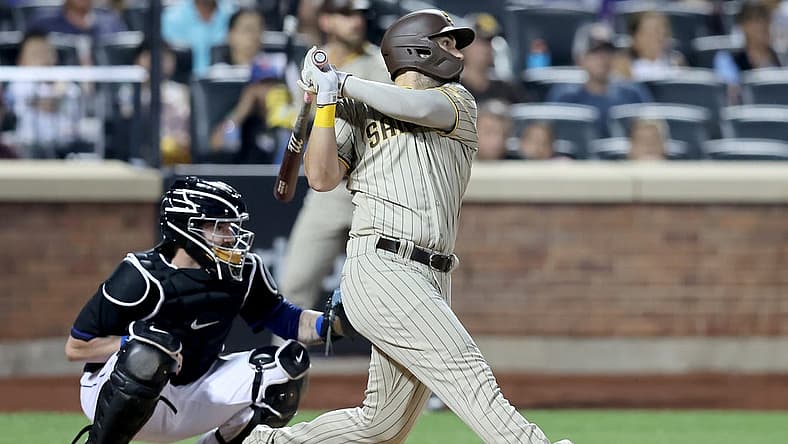 Jul 22, 2022; New York City, New York, USA; San Diego Padres first baseman Eric Hosmer (30) follows through on a two run home run against the New York Mets during the fourth inning at Citi Field. Mandatory Credit: Brad Penner-USA TODAY Sports