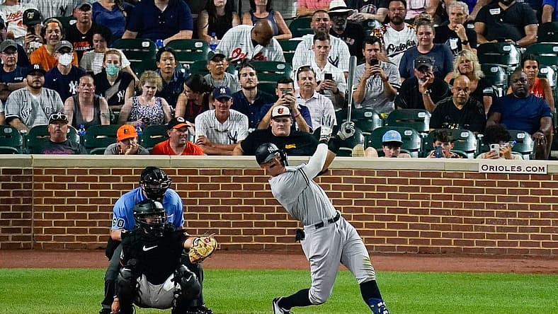Jul 22, 2022; Baltimore, Maryland, USA; New York Yankees center fielder Aaron Judge (99) swings through a solo home run against the Baltimore Orioles at Oriole Park at Camden Yards. Mandatory Credit: Tommy Gilligan-USA TODAY Sports
