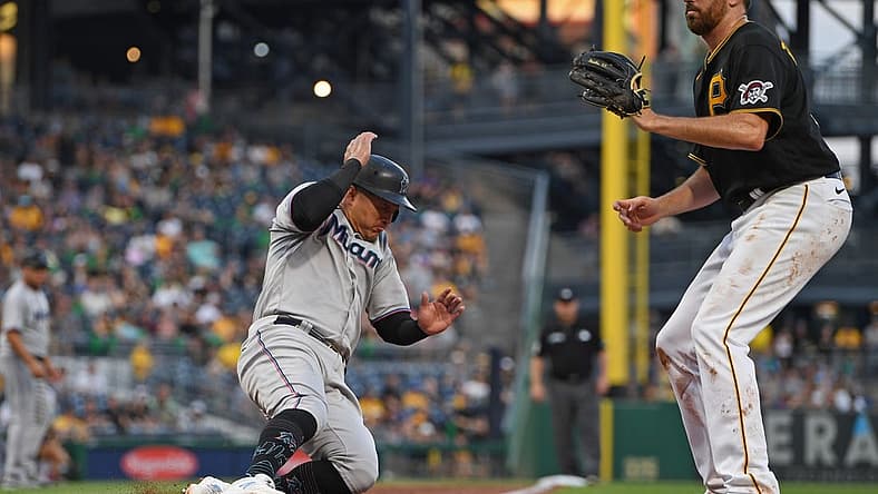Jul 22, 2022; Pittsburgh, Pennsylvania, USA; Miami Marlins right fielder Avisail Garcia (24) scores a run on a wild pitch by Pittsburgh Pirates starting pitcher Zach Thompson (39) during the fourth inning at PNC Park. Mandatory Credit: David Dermer-USA TODAY Sports