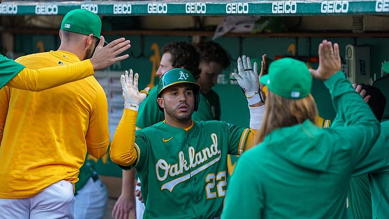 Jul 22, 2022; Oakland, California, USA; Oakland Athletics right fielder Ramon Laureano (22) celebrates with teammate in the dugout after the home run during the fifth inning against the Texas Rangers at RingCentral Coliseum. Mandatory Credit: Neville E. Guard-USA TODAY Sports