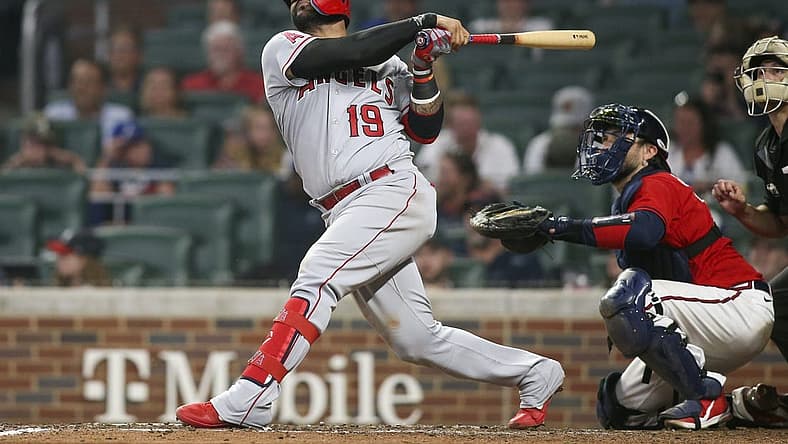 Jul 22, 2022; Atlanta, Georgia, USA; Los Angeles Angels third baseman Jonathan Villar (19) hits a home run against the Atlanta Braves in the ninth inning at Truist Park. Mandatory Credit: Brett Davis-USA TODAY Sports