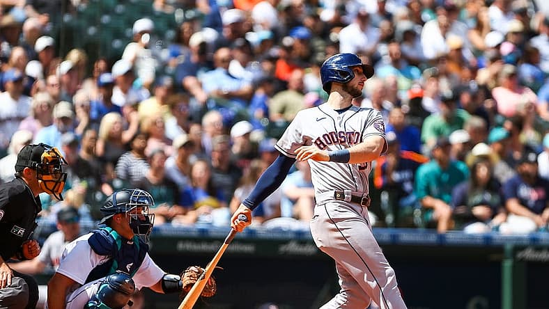 Jul 23, 2022; Seattle, Washington, USA; Houston Astros right fielder Kyle Tucker (30) follows through on an RBI double against the Seattle Mariners during the fourth inning at T-Mobile Park. Mandatory Credit: Lindsey Wasson-USA TODAY Sports