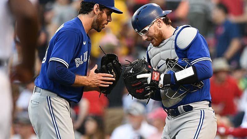 Jul 23, 2022; Boston, Massachusetts, USA; Toronto Blue Jays relief pitcher Jordan Romano (68) and catcher Danny Jansen (9) celebrate after beating the Boston Red Sox at Fenway Park. Mandatory Credit: Brian Fluharty-USA TODAY Sports