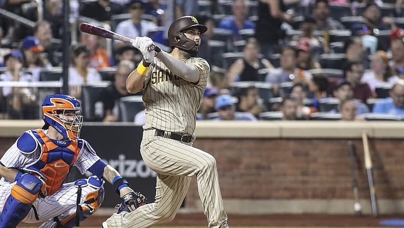 Jul 23, 2022; New York City, New York, USA;  San Diego Padres first baseman Eric Hosmer (30) hits a single against the New York Mets in the fifth inning at Citi Field. Mandatory Credit: Wendell Cruz-USA TODAY Sports