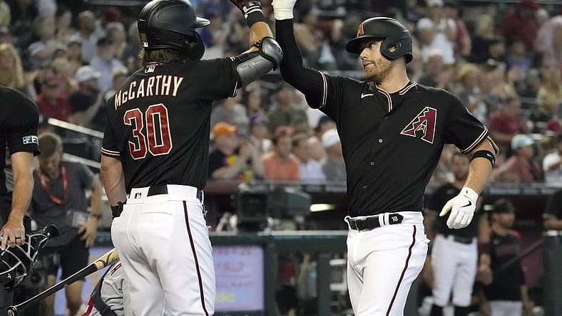 Jul 23, 2022; Phoenix, Arizona, USA; Arizona Diamondbacks first baseman Christian Walker (53) celebrates with center fielder Jake McCarthy (30) after hitting a solo home run against the Washington Nationals in the third inning at Chase Field. Mandatory Credit: Rick Scuteri-USA TODAY Sports