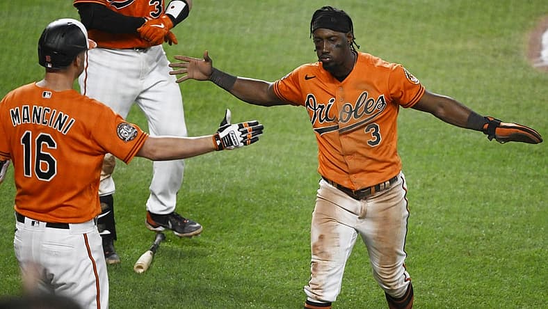 Jul 23, 2022; Baltimore, Maryland, USA;  Baltimore Orioles shortstop Jorge Mateo (3) celebrates with designated hitter Trey Mancini (16) after scoring a run against the New York Yankees during the seventh inning at Oriole Park at Camden Yards. Mandatory Credit: James A. Pittman-USA TODAY Sports