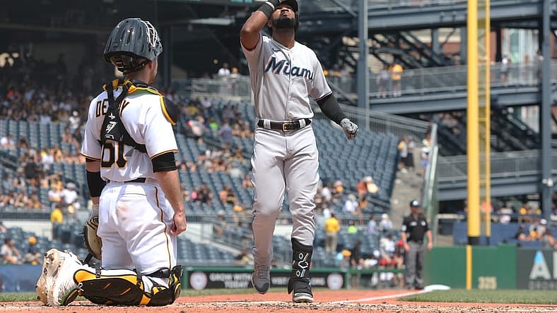Jul 24, 2022; Pittsburgh, Pennsylvania, USA; Miami Marlins right fielder Bryan De La Cruz (14) crosses home plate on a solo home run against the Pittsburgh Pirates during the fifth inning at PNC Park. Mandatory Credit: Charles LeClaire-USA TODAY Sports