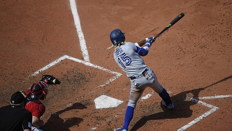 Jul 24, 2022; Boston, Massachusetts, USA; Toronto Blue Jays left fielder Raimel Tapia (15) hits an RBI single during the fifth inning against the Boston Red Sox at Fenway Park. Mandatory Credit: Bob DeChiara-USA TODAY Sports