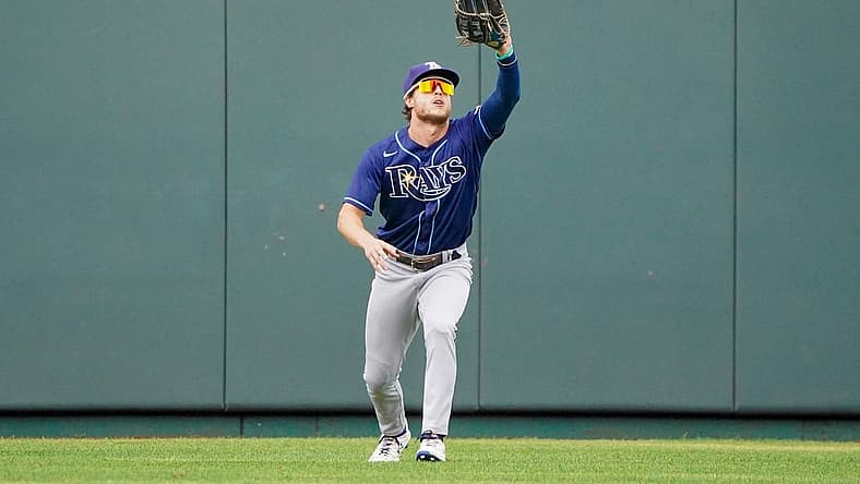 Jul 24, 2022; Kansas City, Missouri, USA; Tampa Bay Rays center fielder Roman Quinn (25) fields a long fly ball against the Kansas City Royals in the seventh inning at Kauffman Stadium. Mandatory Credit: Denny Medley-USA TODAY Sports