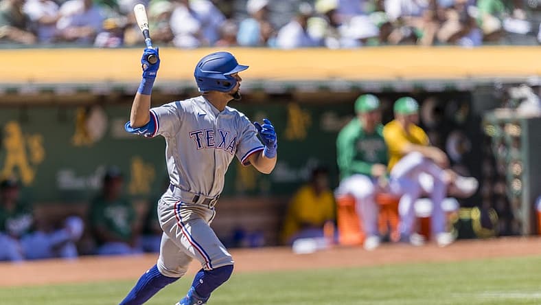 Jul 24, 2022; Oakland, California, USA; Texas Rangers center fielder Leody Taveras (3) grounds a single to load the bases against the Oakland Athletics during the fifth inning at RingCentral Coliseum. Mandatory Credit: John Hefti-USA TODAY Sports