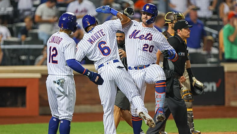 Jul 24, 2022; New York City, New York, USA; New York Mets first baseman Pete Alonso (20) celebrates with right fielder Starling Marte (6) and shortstop Francisco Lindor (12) after hitting a three run home run during the sixth inning against the San Diego Padres at Citi Field. Mandatory Credit: Vincent Carchietta-USA TODAY Sports