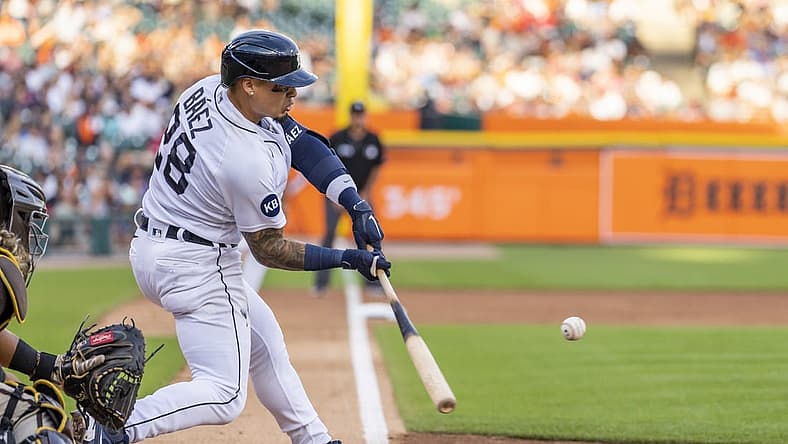 Jul 25, 2022; Detroit, Michigan, USA; Detroit Tigers shortstop Javier Baez (28) hits a sacrifice fly during the third inning against the San Diego Padres at Comerica Park. Mandatory Credit: Raj Mehta-USA TODAY Sports