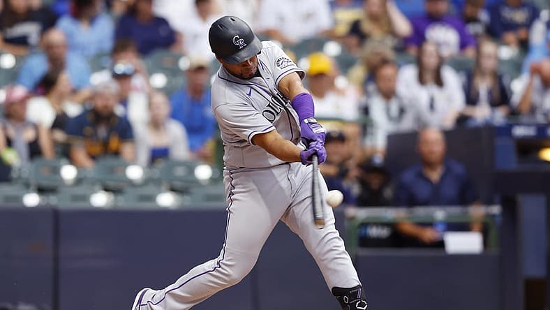 Jul 25, 2022; Milwaukee, Wisconsin, USA; Colorado Rockies catcher Elias D az (35) hits a home run during the third inning against the Milwaukee Brewers at American Family Field. Mandatory Credit: Jeff Hanisch-USA TODAY Sports