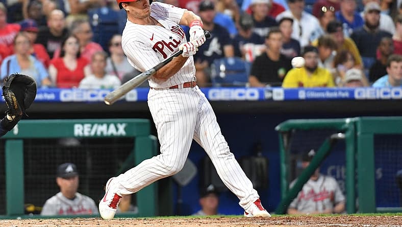 Jul 25, 2022; Philadelphia, Pennsylvania, USA; Philadelphia Phillies catcher J.T. Realmuto (10) hits an RBI single during the third inning at Citizens Bank Park. Mandatory Credit: Eric Hartline-USA TODAY Sports