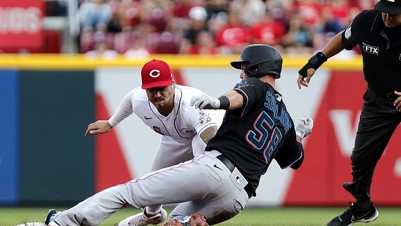Jul 26, 2022; Cincinnati, Ohio, USA; Miami Marlins catcher Jacob Stallings (58) is tagged out at second against Cincinnati Reds second baseman Jonathan India (6) during the third inning at Great American Ball Park. Mandatory Credit: David Kohl-USA TODAY Sports