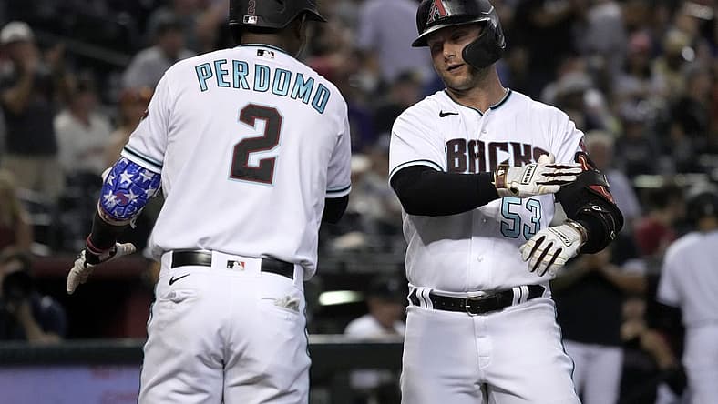 Jul 26, 2022; Phoenix, Arizona, USA; Arizona Diamondbacks first baseman Christian Walker (53) celebrates with shortstop Geraldo Perdomo (2) after hitting a three-run homerun against the San Francisco Giants in the third inning at Chase Field. Mandatory Credit: Rick Scuteri-USA TODAY Sports