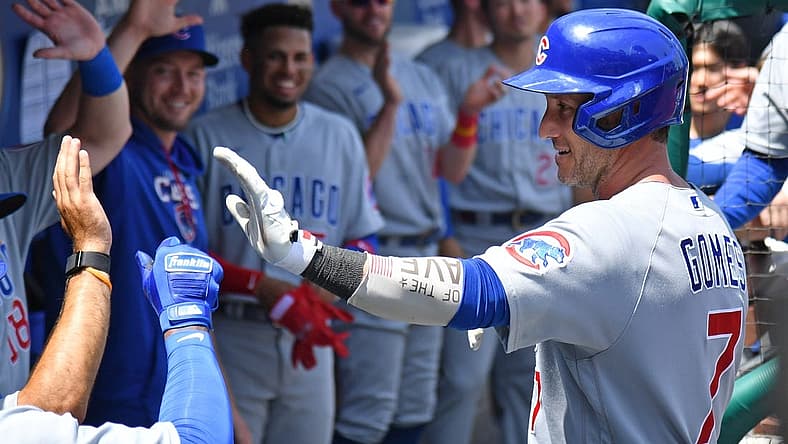 Jul 24, 2022; Philadelphia, Pennsylvania, USA; Chicago Cubs catcher Yan Gomes (7) celebrates his home run in the dugout against the Philadelphia Phillies at Citizens Bank Park. Mandatory Credit: Eric Hartline-USA TODAY Sports