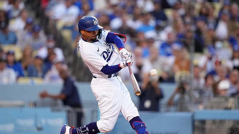 Jul 26, 2022; Los Angeles, California, USA; Los Angeles Dodgers right fielder Mookie Betts (50) follows through on a solo home run in the first inning against the Washington Nationals at Dodger Stadium. Mandatory Credit: Kirby Lee-USA TODAY Sports