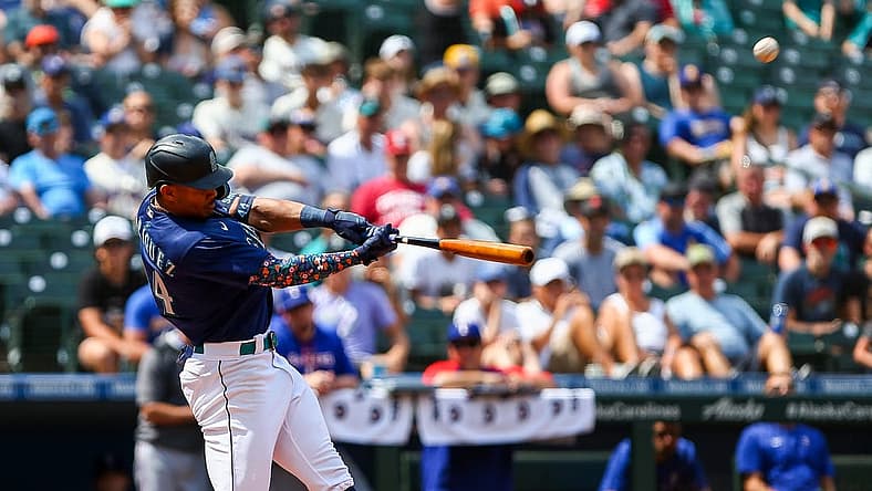 Jul 27, 2022; Seattle, Washington, USA; Seattle Mariners center fielder Julio Rodriguez (44) hits a three-run home run against the Texas Rangers during the seventh inning at T-Mobile Park. Mandatory Credit: Lindsey Wasson-USA TODAY Sports