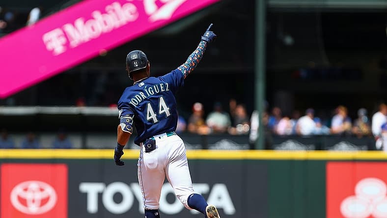 Jul 27, 2022; Seattle, Washington, USA; Seattle Mariners center fielder Julio Rodriguez (44) points to the sky as he rounds the bases after hitting a three-run home run against the Texas Rangers during the seventh inning at T-Mobile Park. Mandatory Credit: Lindsey Wasson-USA TODAY Sports