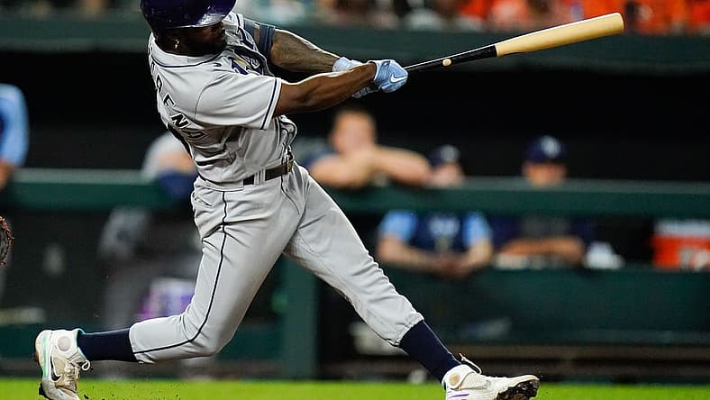 Jul 27, 2022; Baltimore, Maryland, USA; Tampa Bay Rays left fielder Randy Arozarena (56) hits a two run double in the tenth inning against the Baltimore Orioles at Oriole Park at Camden Yards. Mandatory Credit: Tommy Gilligan-USA TODAY Sports